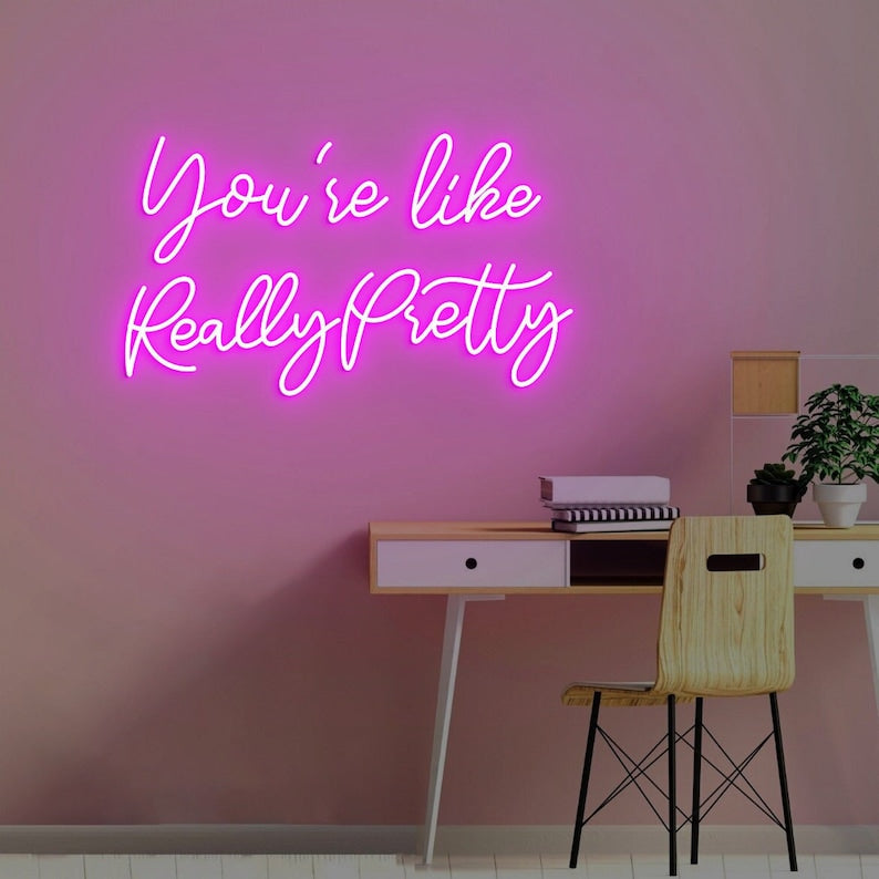 You're like Really Pretty Neon, Neon sign, Complimentary salon decor, Beauty compliment, Vibrant lighting, Stylish ambiance, Illuminated sign, Trendy neon sign, Chic beauty studio, Salon atmosphere, Compliment-inspired decor.